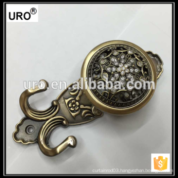 brass curtain tieback for window